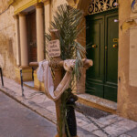Easter time in Valletta with a plaque "He died for you, do you love him enough in English