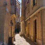 Narrow streets that lead down to the harbor in Valletta