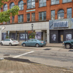 View of Main Street Store Fronts with portraits