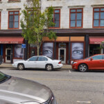 View of Store Fronts on Main Street showing portraits
