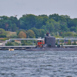 View of Thames River with a submarine moving up river
